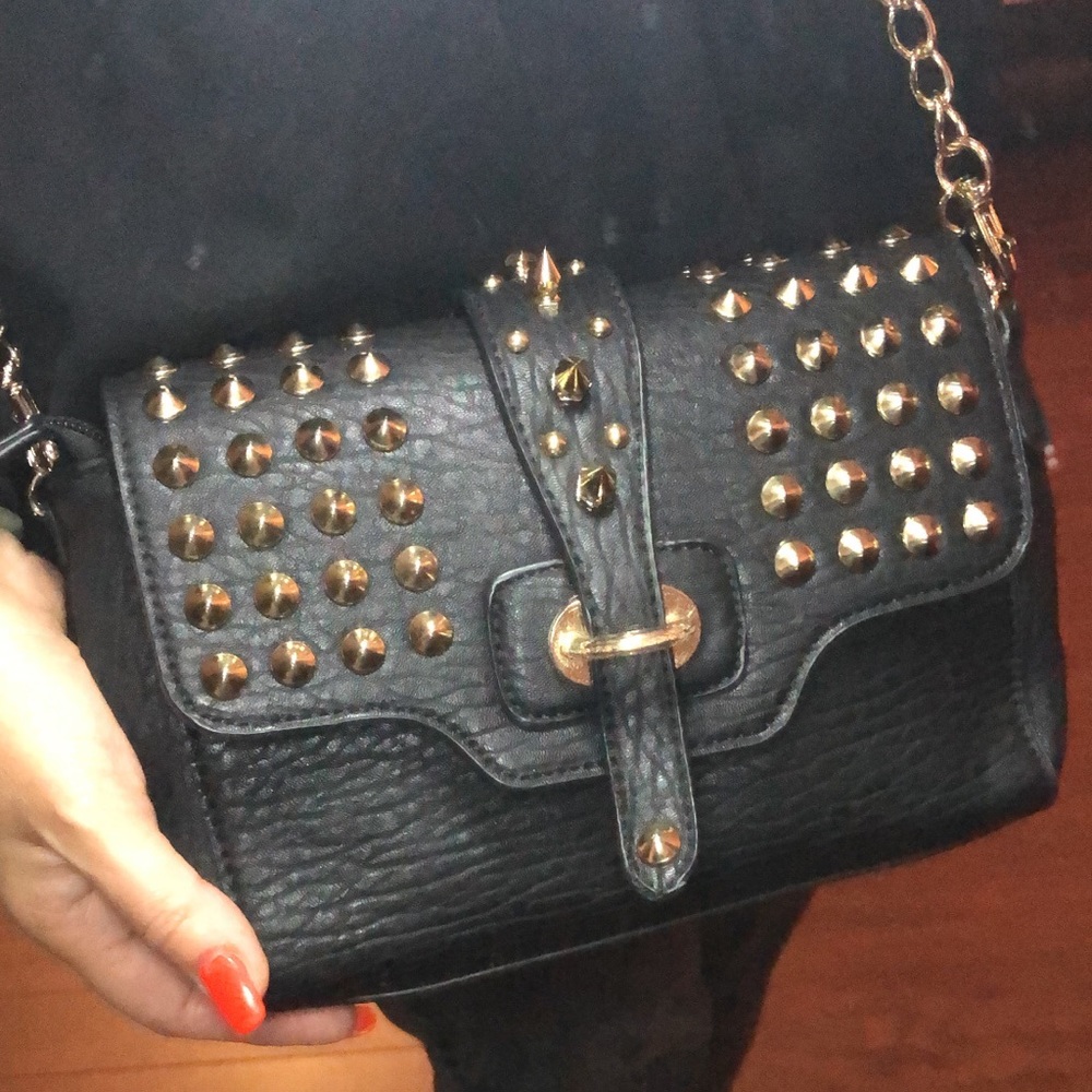 Stylish bag.There are spikes and rivets on the bag